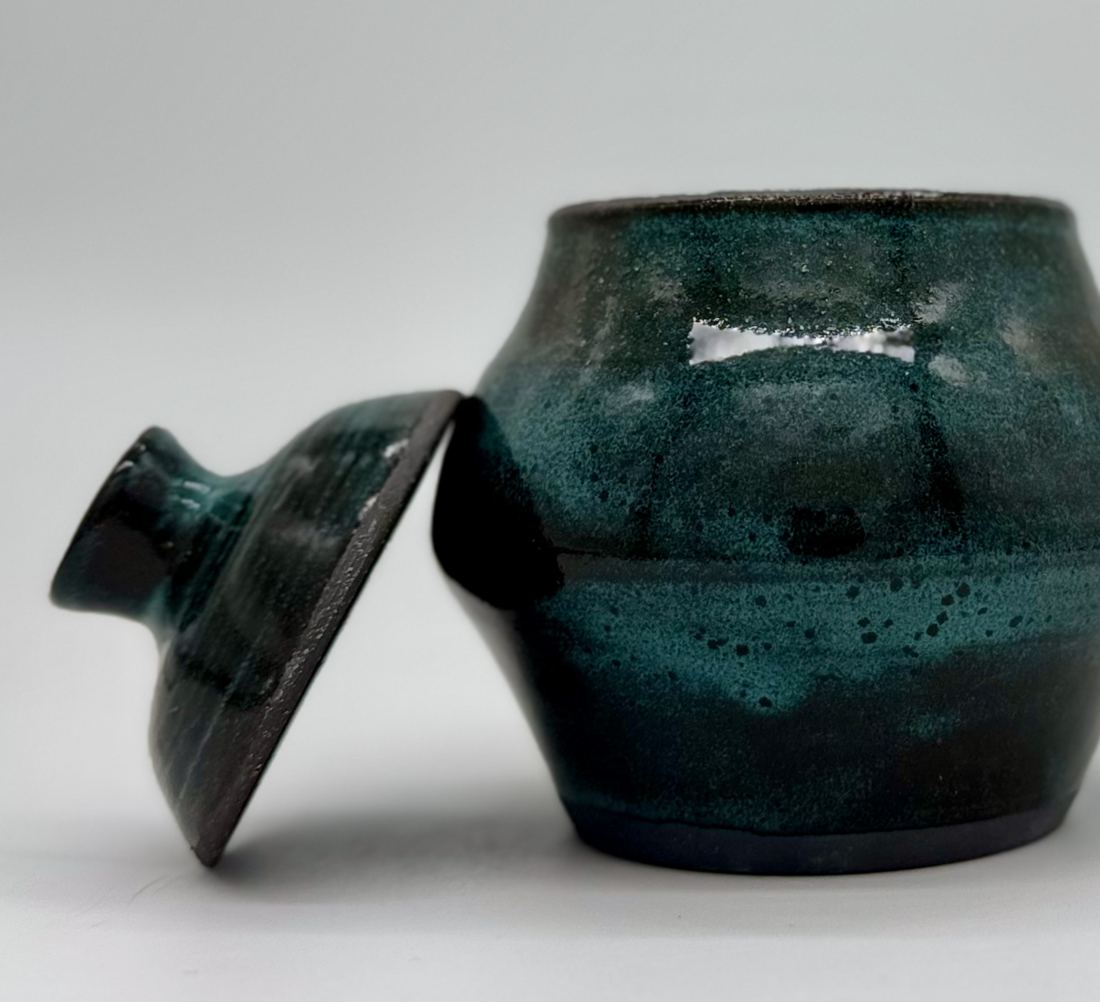 Round lidded jar in deep glossy teal